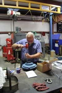 Richard West, pump service, works on a bearing housing for one of two Flygt 4430 banana blade mixers he was rebuilding.